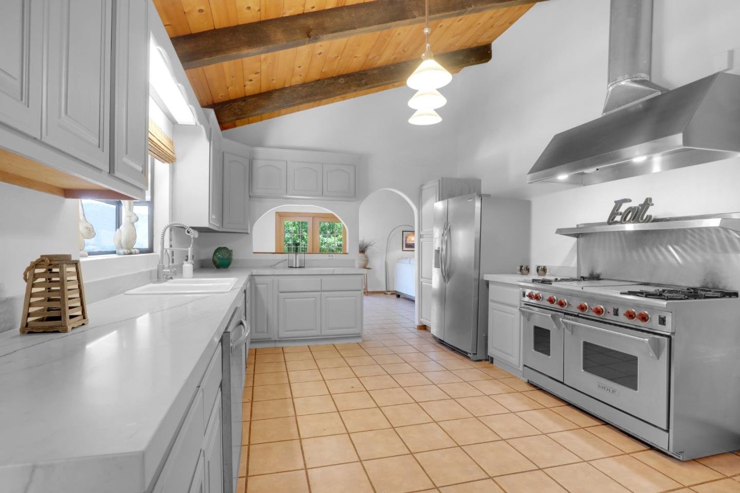 19235 Cachagua Road Carmel Valley, CA 93924 - Photo 5 of 34 a kitchen with stainless steel appliances a stove a sink and a stove