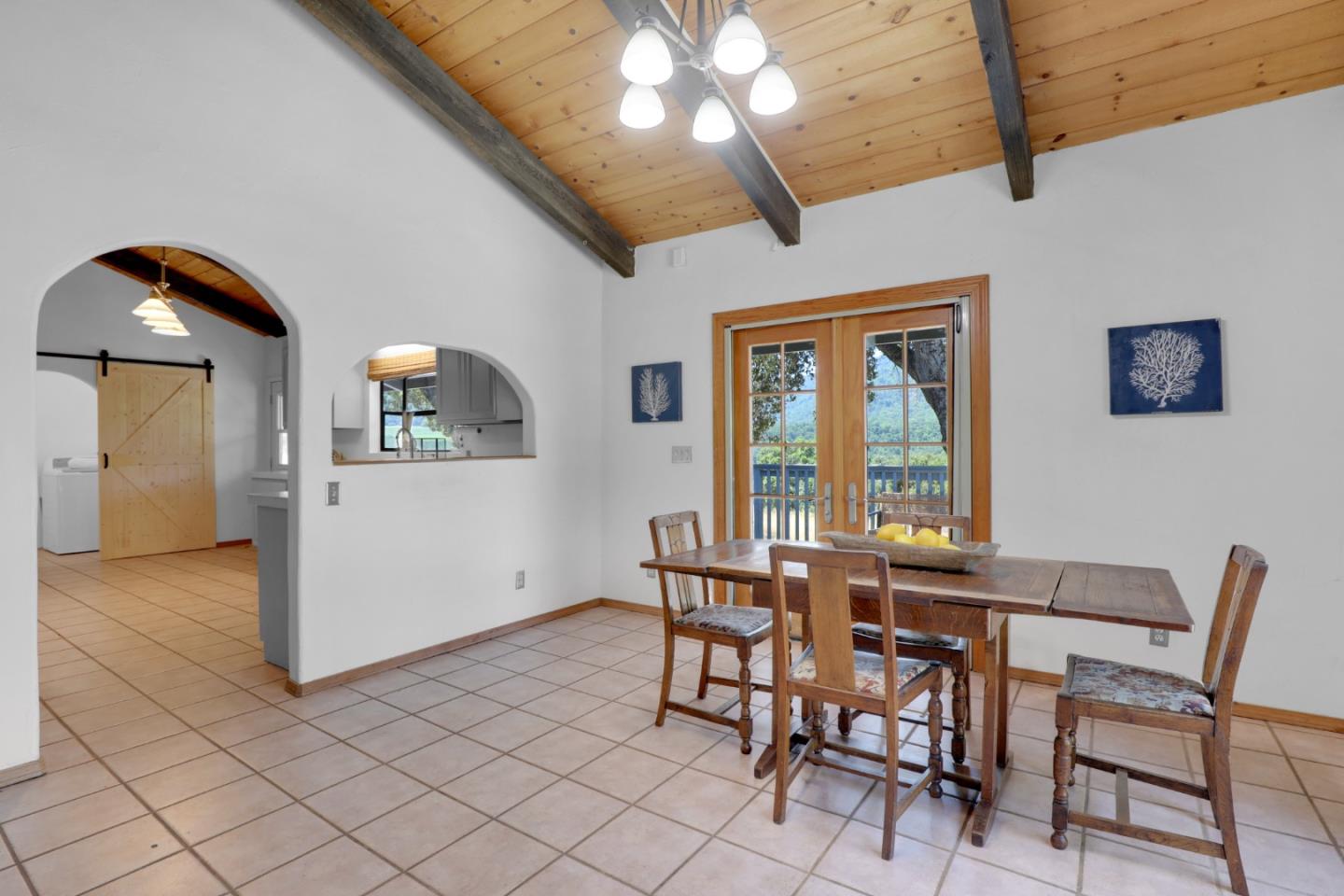 19235 Cachagua Road Carmel Valley, CA 93924 - Photo 6 of 34 a view of a dining room with furniture and chandelier