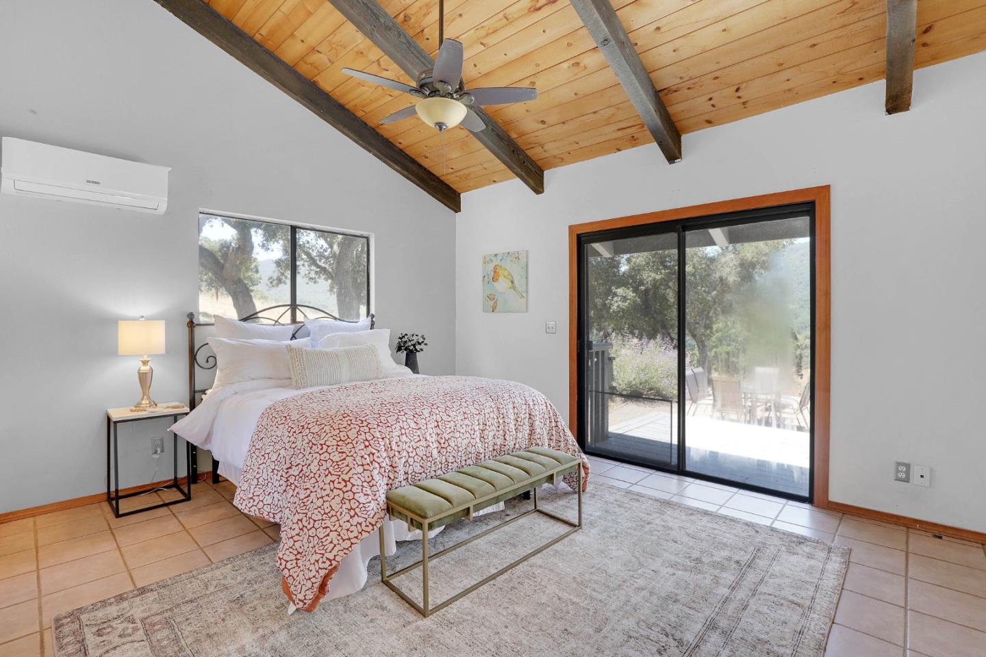 19235 Cachagua Road Carmel Valley, CA 93924 - Photo 8 of 34 a bedroom with a bed and large window