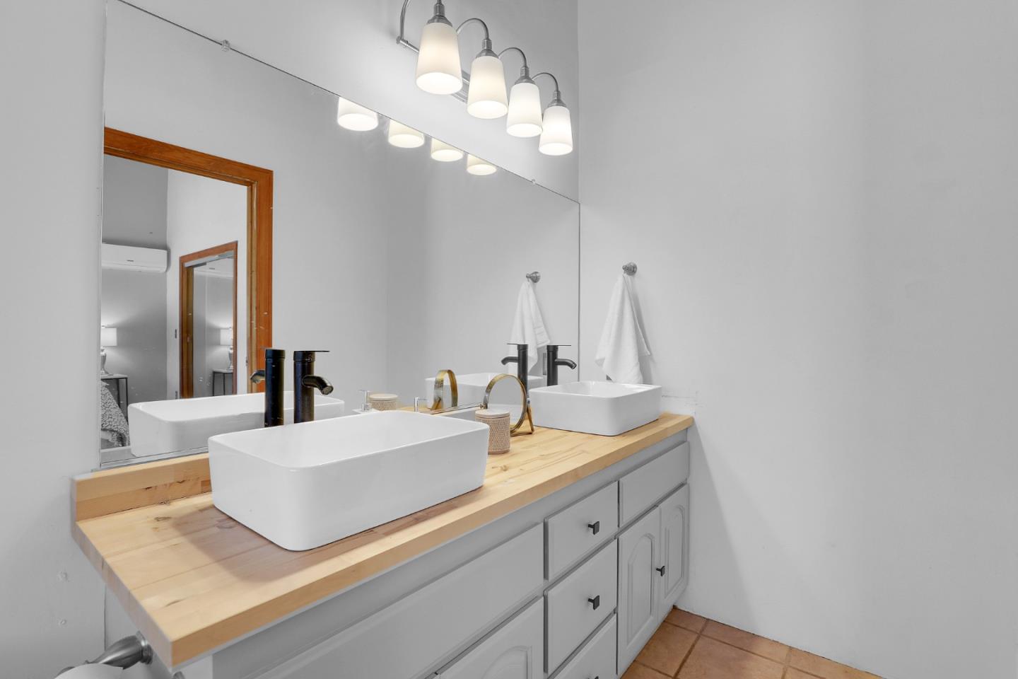 19235 Cachagua Road Carmel Valley, CA 93924 - Photo 10 of 34 a bathroom with a sink and a mirror
