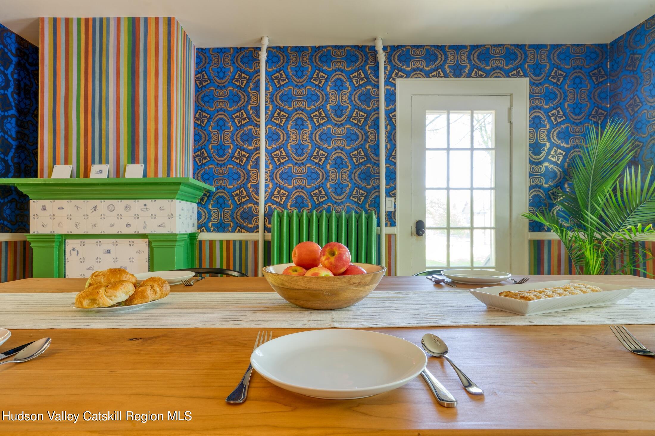 3714 Main Street Stone Ridge, NY 12484 - Photo 12 of 31 a dining room with fireplace furniture and a large window