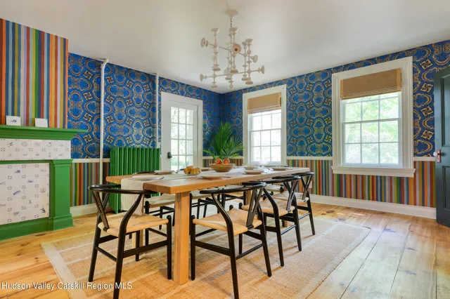a kitchen with kitchen island granite countertop a sink and a stove