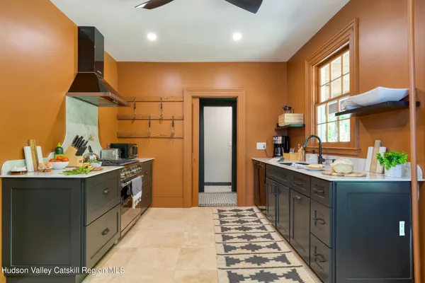 a kitchen with a sink and a window