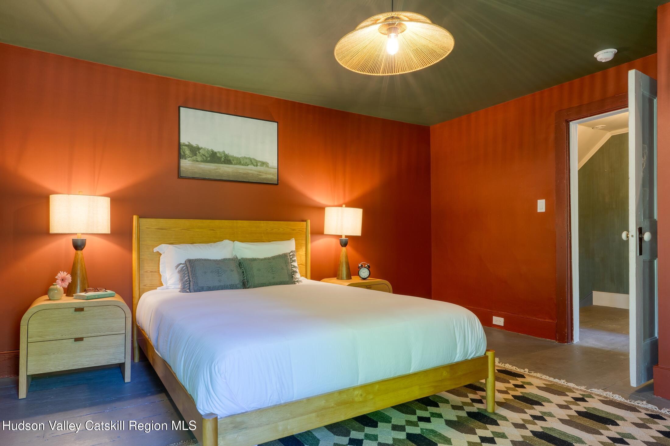 3714 Main Street Stone Ridge, NY 12484 - Photo 21 of 31 a bedroom with a bed and a lamp