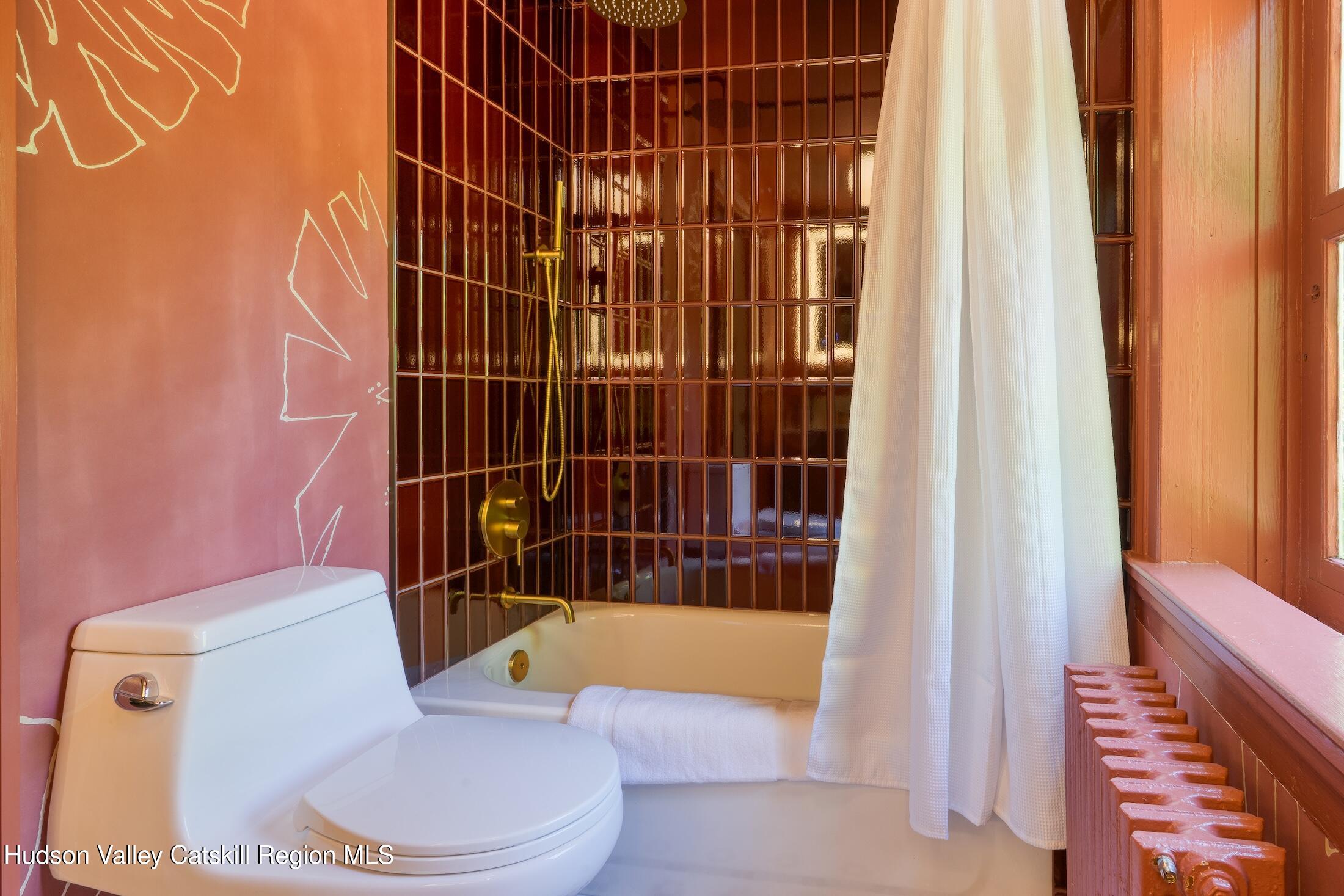 3714 Main Street Stone Ridge, NY 12484 - Photo 24 of 31 a bathroom with a toilet and shower