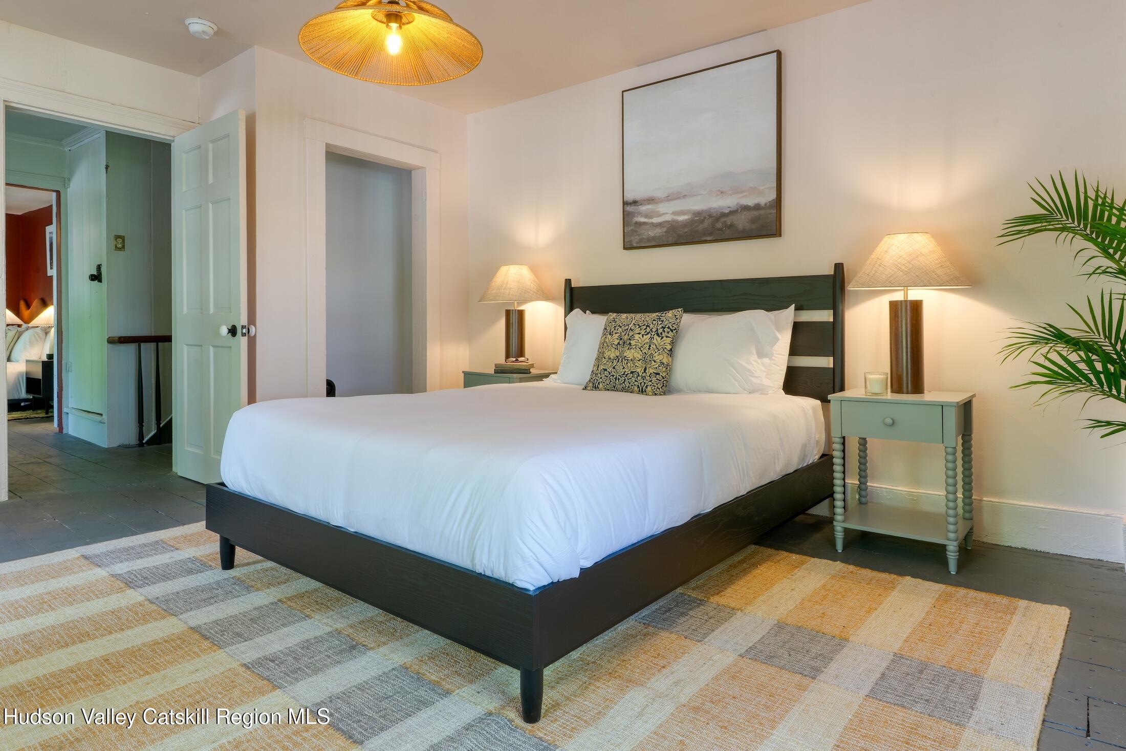 3714 Main Street Stone Ridge, NY 12484 - Photo 25 of 31 a bedroom with a bed and lamps