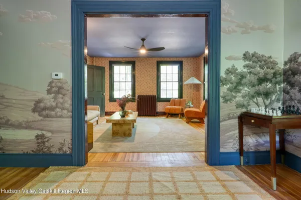 a living room with furniture and a large window