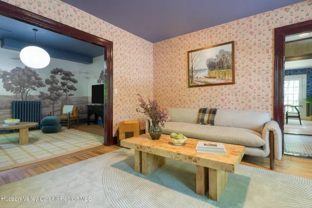 a living room with furniture and a window