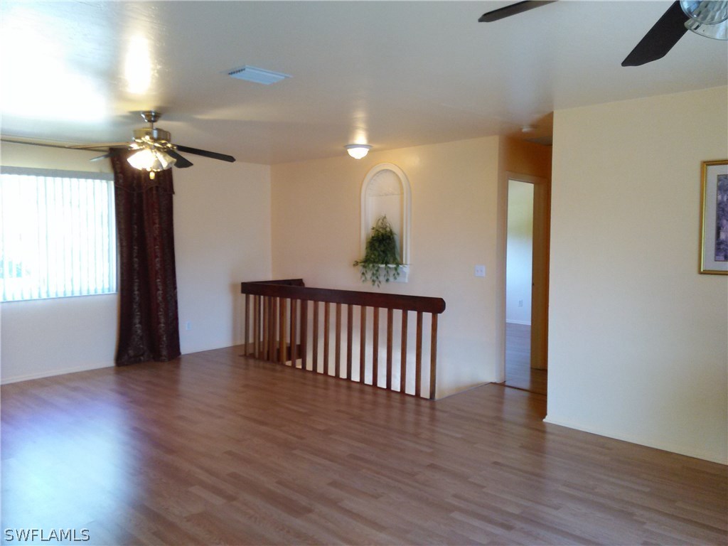 8438 Robin Road Fort Myers, FL 33967 - Photo 5 of 24 a view of entryway with wooden floor