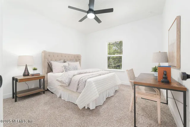 a bedroom with a bed and a table in it