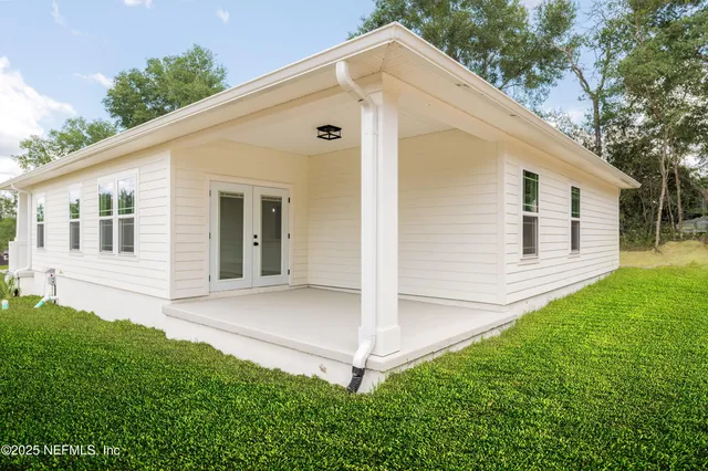 a view of backyard with a garden and plants