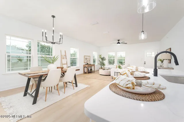 a living room with furniture a window and a table