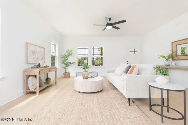 a living room with furniture and a fireplace