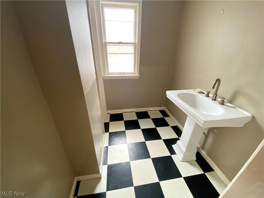 2927 Huntington Road Cleveland, OH 44120 - Photo 10 of 12 Bathroom with washbasin and tile flooring