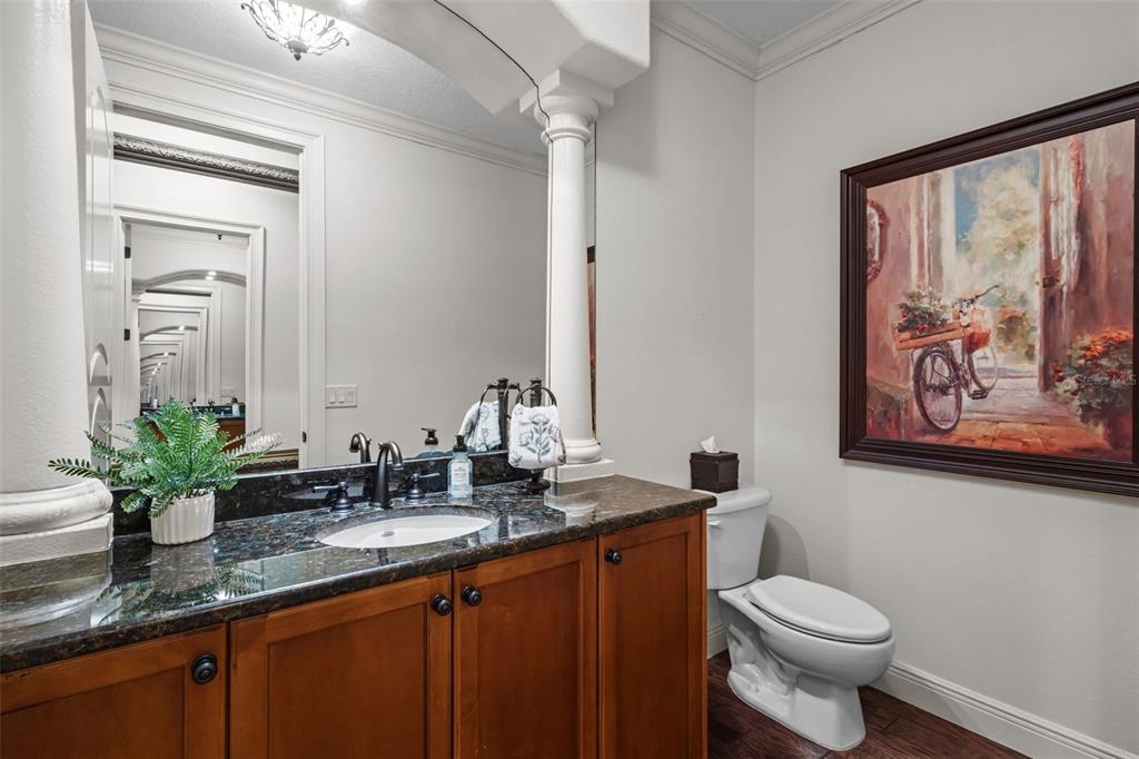 10826 Alico Pass New Port Richey, FL 34655 - Photo 24 of 51 a bathroom with a granite countertop sink mirror and toilet
