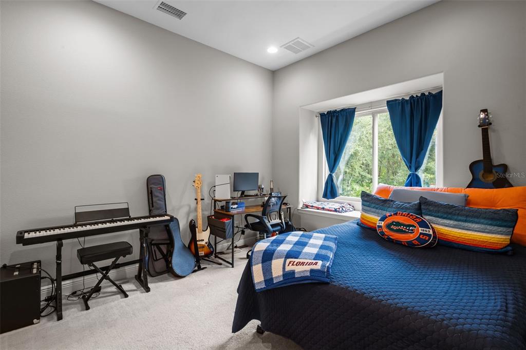 10826 Alico Pass New Port Richey, FL 34655 - Photo 25 of 51 a children room with furniture and a window
