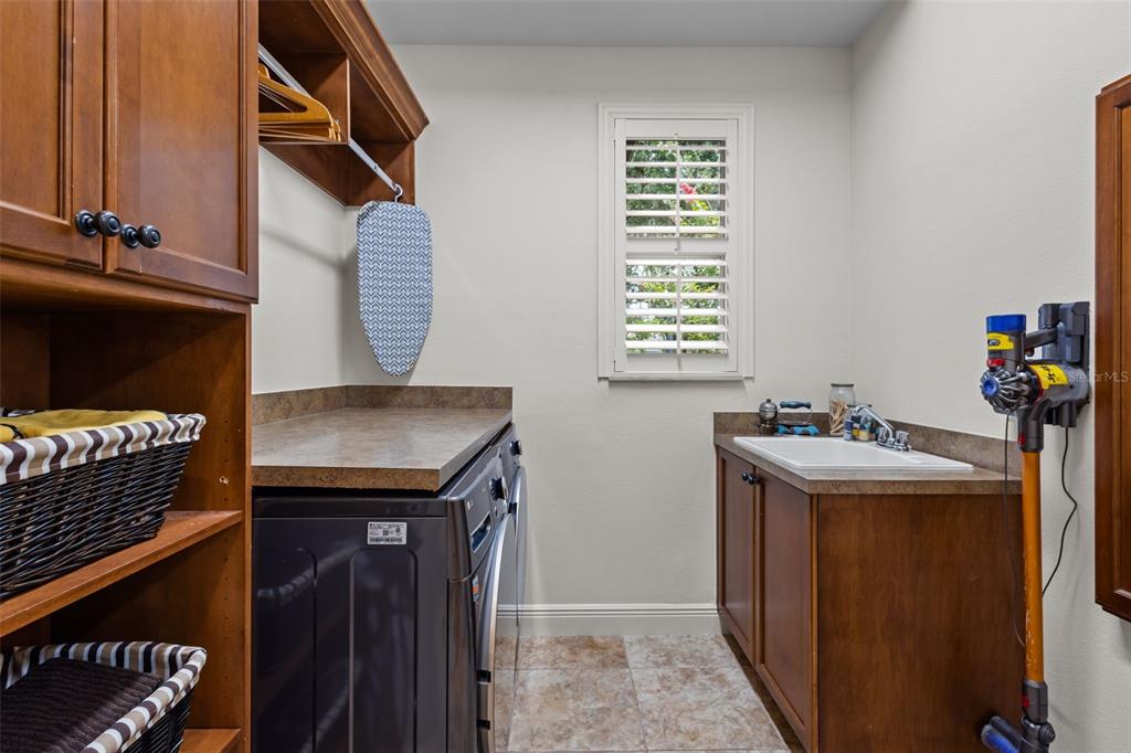 10826 Alico Pass New Port Richey, FL 34655 - Photo 31 of 51 a utility room with dryer and washer