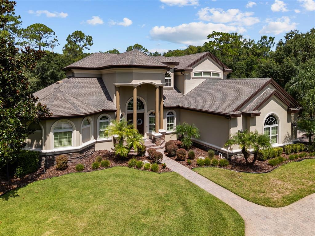 10826 Alico Pass New Port Richey, FL 34655 - Photo 45 of 51 a front view of a house with garden