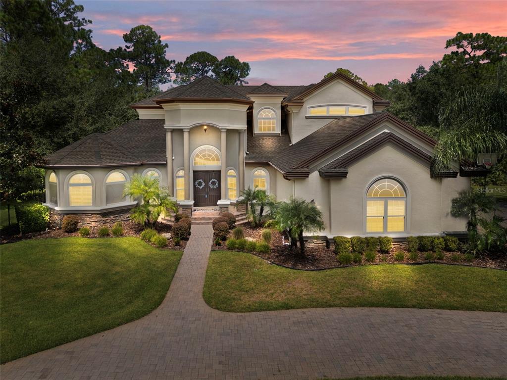 10826 Alico Pass New Port Richey, FL 34655 - Photo 50 of 51 a front view of a house with a yard and garage