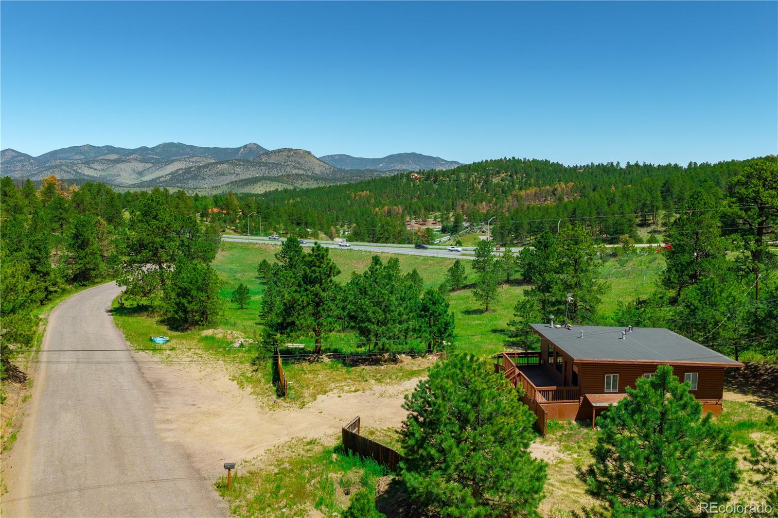 29793 Ruby Ranch Road Evergreen, CO 80439 - Photo 14 of 28 a view of a garden with a lake view