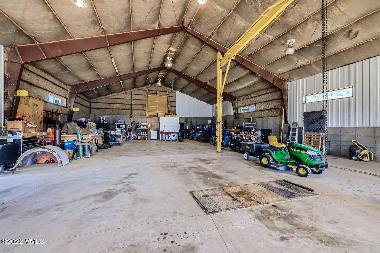 290 Amherst Road Gypsum, CO 81637 - Photo 25 of 32 a view of parking garage with cars