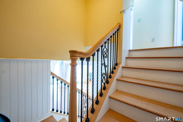 a view of staircase with railing and a stairs
