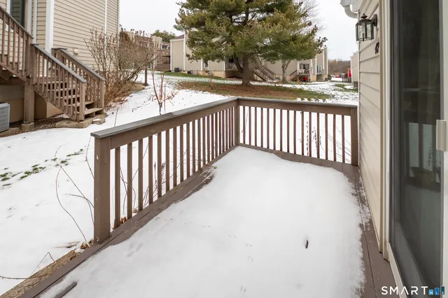 a view of a balcony with a small yard