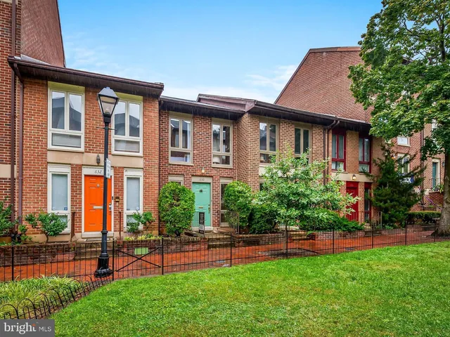 a front view of a house with a yard table and chairs