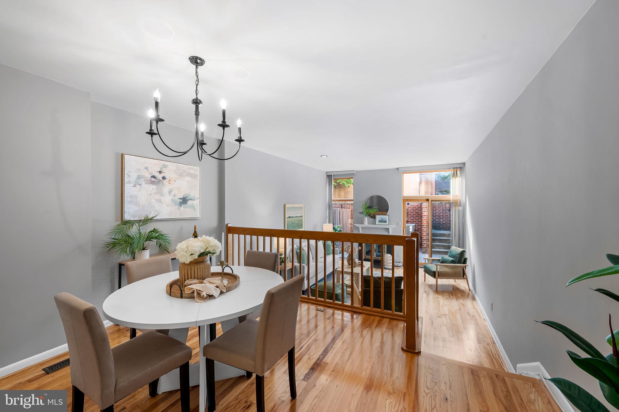 630 South Hanover Street Baltimore, MD 21230 - Photo 11 of 55 a view of a dining room with furniture wooden floor and chandelier