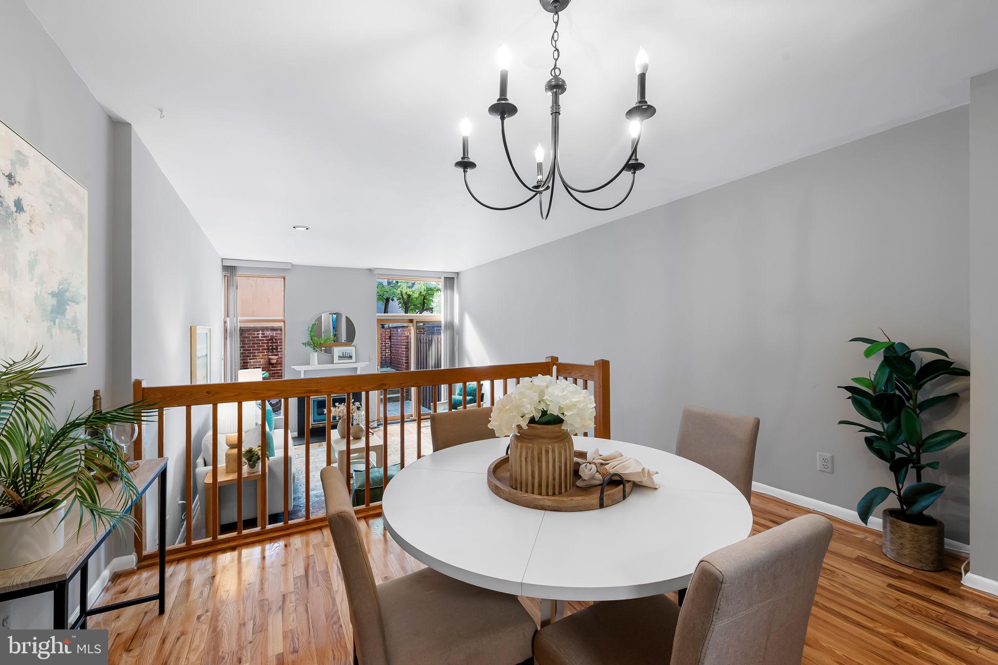 630 South Hanover Street Baltimore, MD 21230 - Photo 13 of 55 a view of a dining room with furniture window and wooden floor