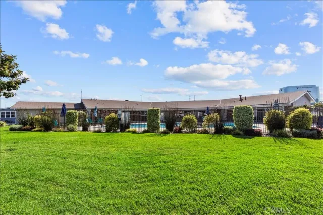 a dining room with lots of furniture and chandelier