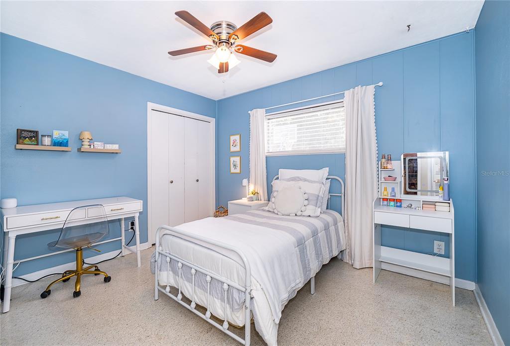 2464 Hunterfield Road Maitland, FL 32751 - Photo 19 of 26 a bedroom with a bed and a chandelier