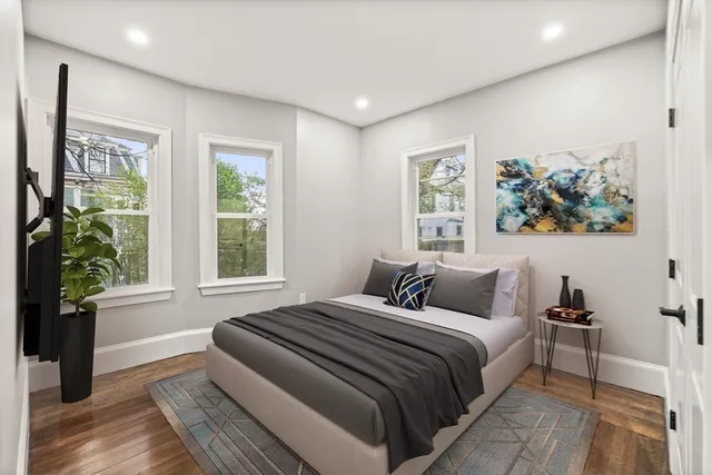 a bedroom with bed and a window