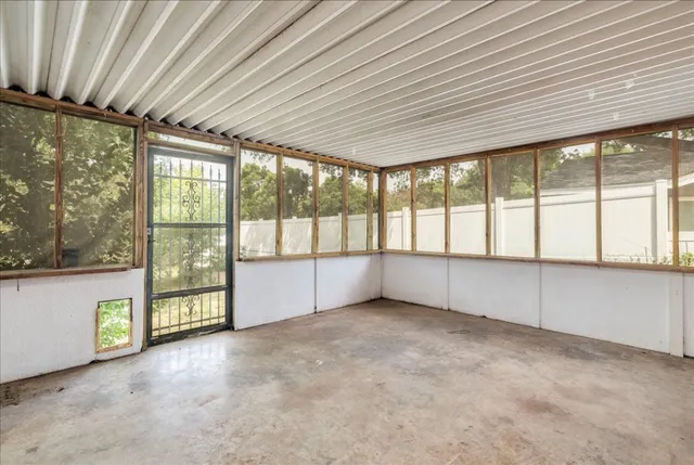 an empty room with a large window