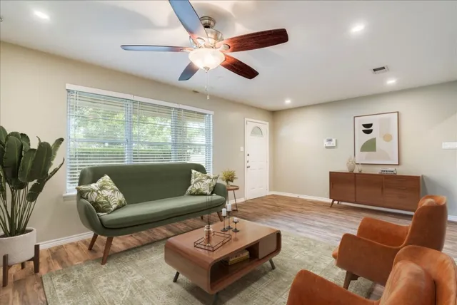 a living room with furniture and a large window