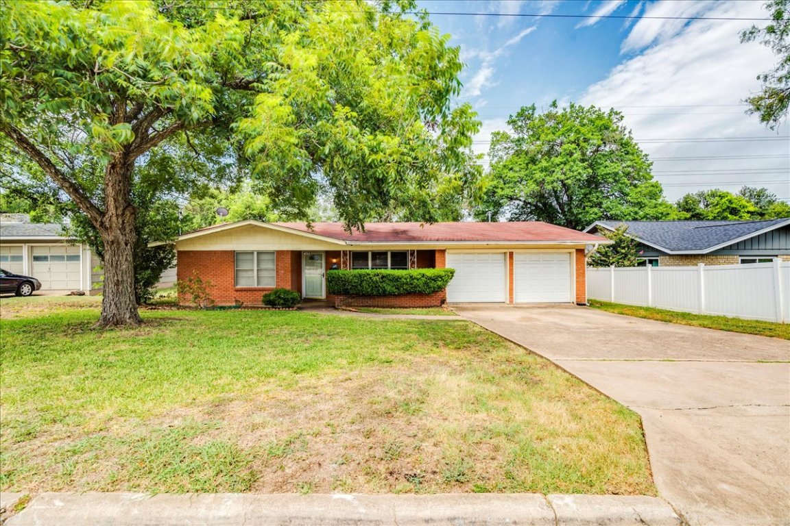 4712 Frontier Trail Austin, TX 78745 - Photo 31 of 32 a front view of a house with garden