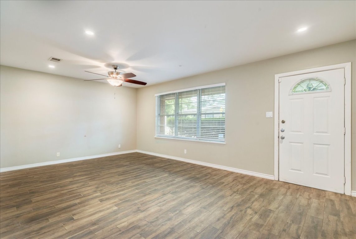 4712 Frontier Trail Austin, TX 78745 - Photo 6 of 32 wooden floor in an empty room with a window