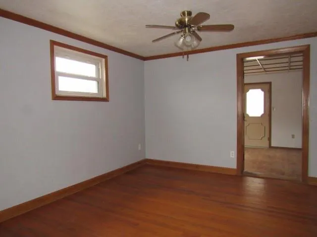 a kitchen with granite countertop cabinets and window
