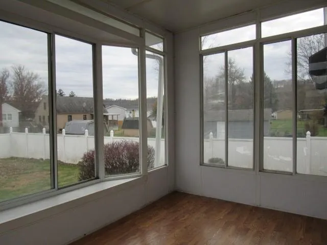 a view of a glass door and the floor to ceiling window