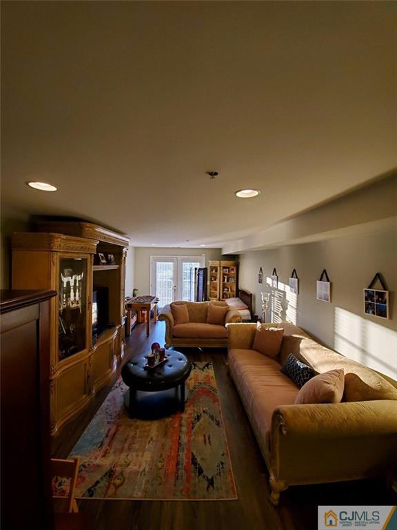 4 Raritan Reach Road, Unit 1002 South Amboy, NJ 08879 - Photo 13 of 19 a living room with furniture and a wooden floor