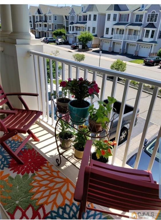 4 Raritan Reach Road, Unit 1002 South Amboy, NJ 08879 - Photo 14 of 19 a view of a balcony with chairs