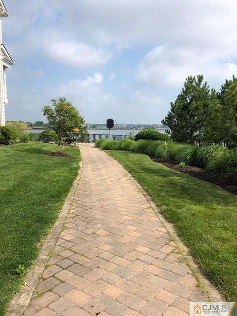 4 Raritan Reach Road, Unit 1002 South Amboy, NJ 08879 - Photo 17 of 19 a view of building with garden