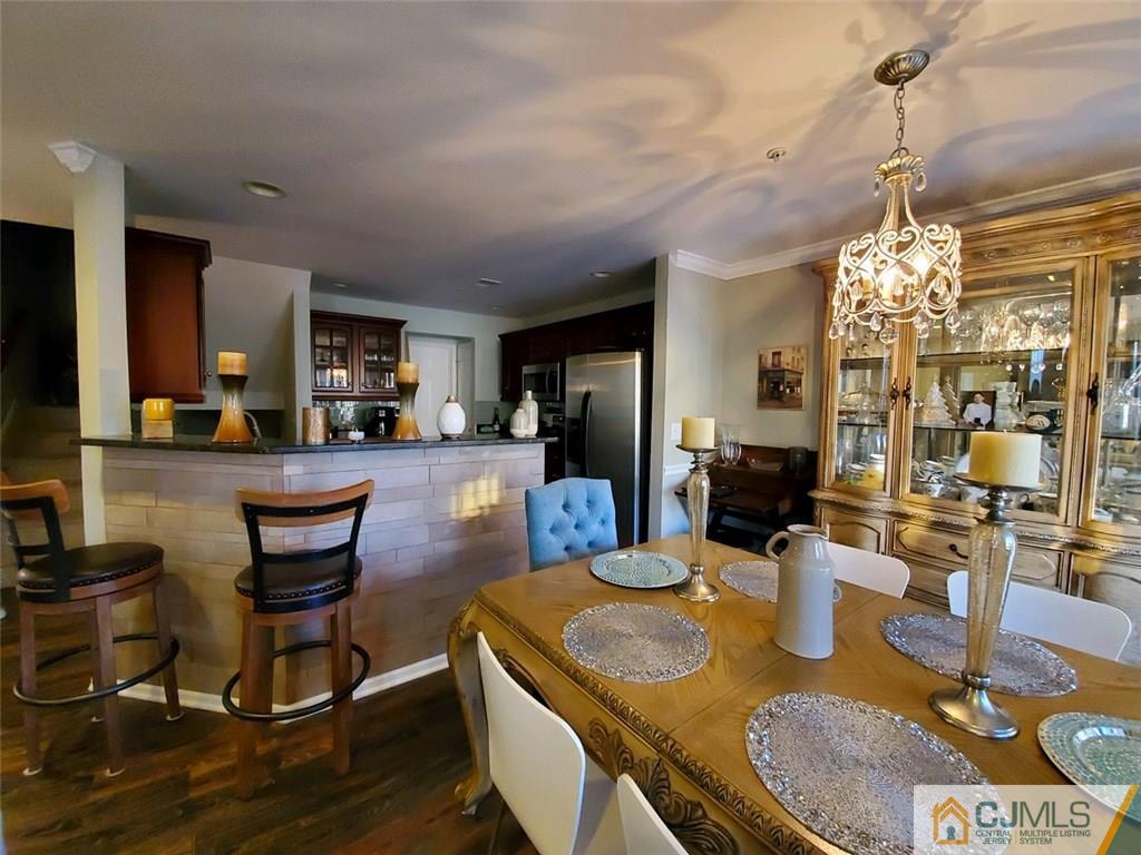 4 Raritan Reach Road, Unit 1002 South Amboy, NJ 08879 - Photo 6 of 19 a view of a dining room with furniture