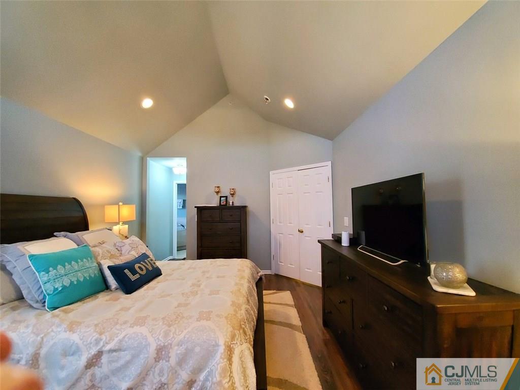4 Raritan Reach Road, Unit 1002 South Amboy, NJ 08879 - Photo 7 of 19 a bedroom with a bed and a flat screen tv
