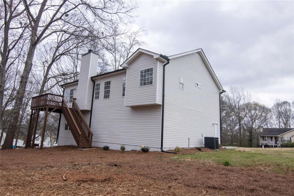 824 Eastmont Road Winder, GA 30680 - Photo 11 of 35 a house with trees in front of it