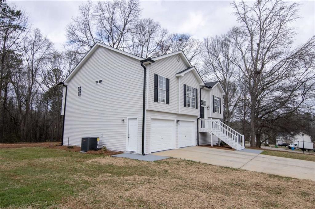824 Eastmont Road Winder, GA 30680 - Photo 15 of 35 a view of a house with a yard covered in snow