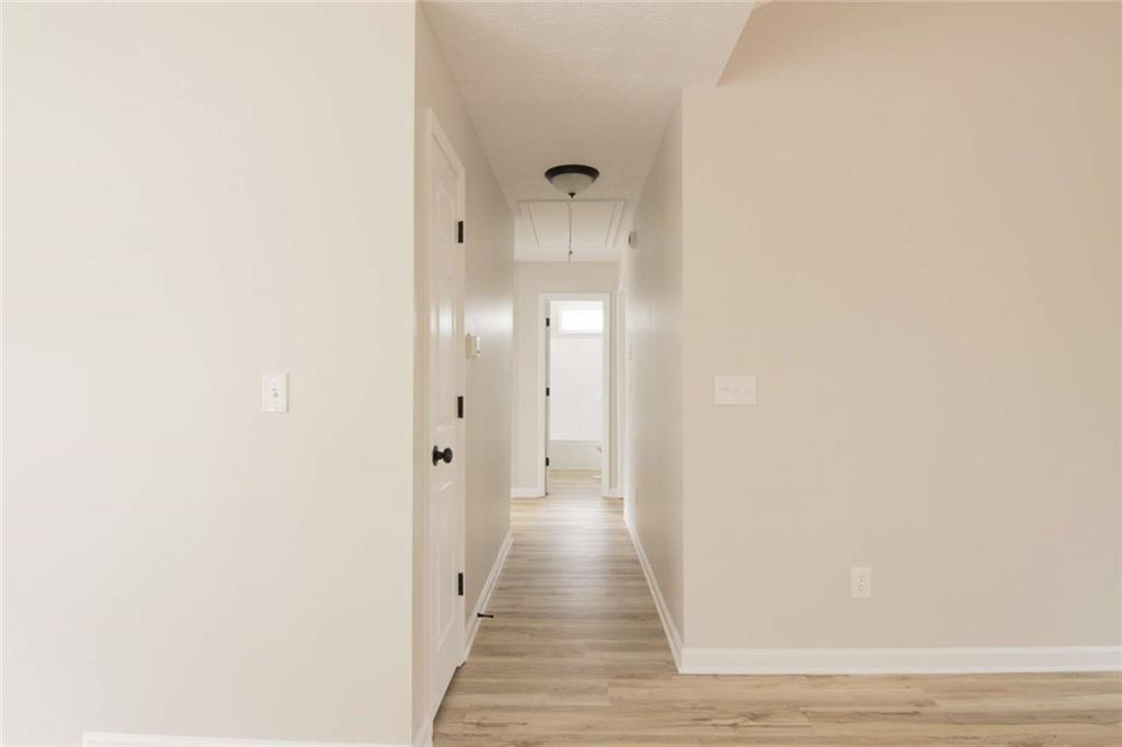 824 Eastmont Road Winder, GA 30680 - Photo 21 of 35 a view of a hallway with wooden floor