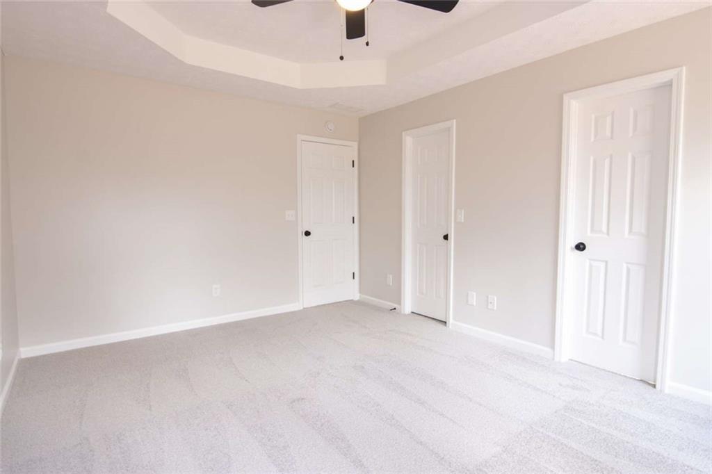 824 Eastmont Road Winder, GA 30680 - Photo 25 of 35 an empty room with fan and windows