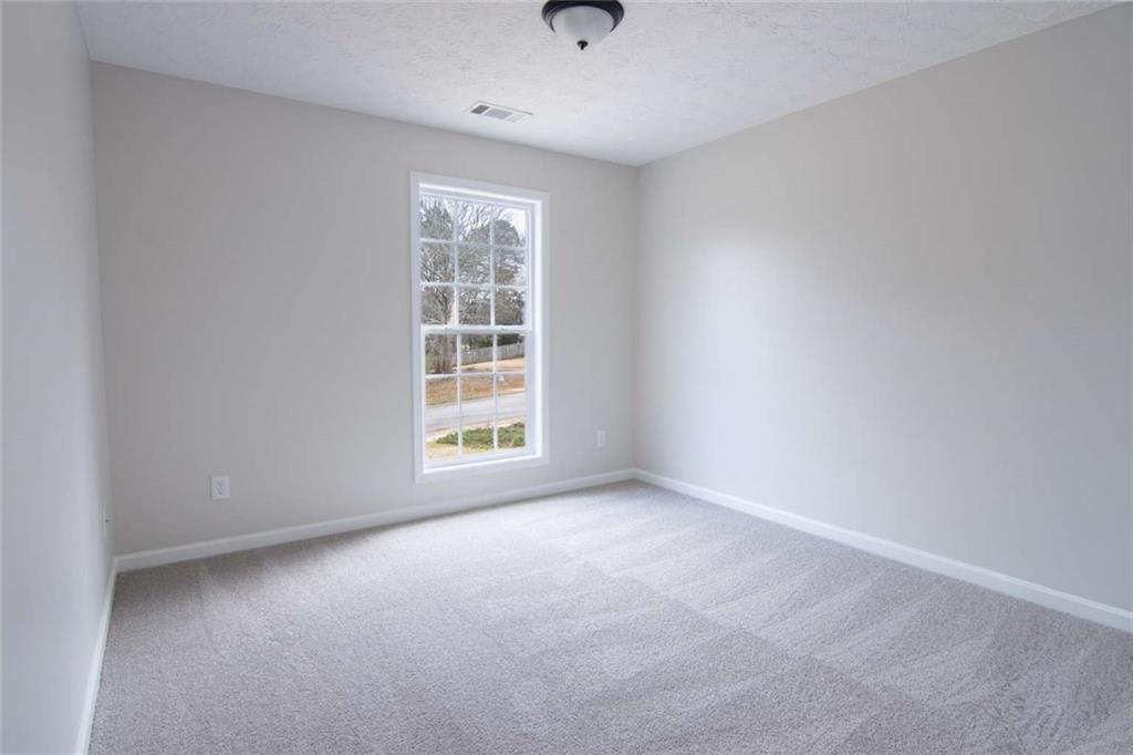 824 Eastmont Road Winder, GA 30680 - Photo 27 of 35 an empty room with windows