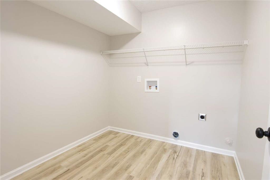 824 Eastmont Road Winder, GA 30680 - Photo 31 of 35 a view of a room with racks on the wall